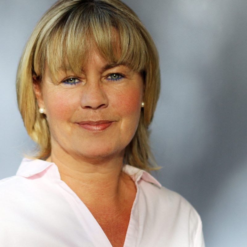 Businessfoto einer Frau bei Tageslicht